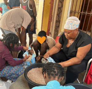 haitians helping prepare food for a service project